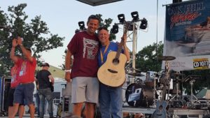 John Adams winning a signed guitar by LOCASH and Casey M. 