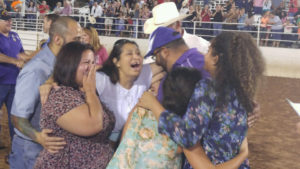 Tomas Garcia and his family accepting their free house for veteran